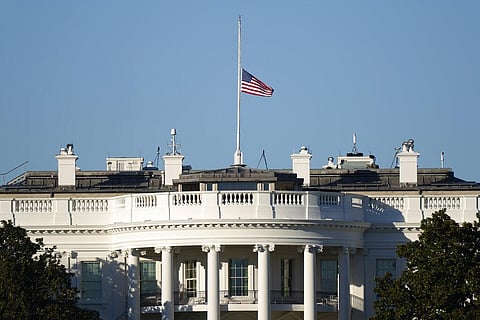 An American flag flies at half-staff above the White House in Washington, Sunday, Jan. 10, 2021. (Photo | AP)