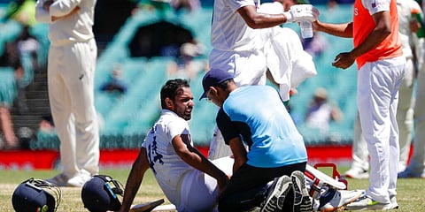 India's Hanuma Vihari receives treatment to a leg injury during play on the final day of the third Test. (Photo | AP)