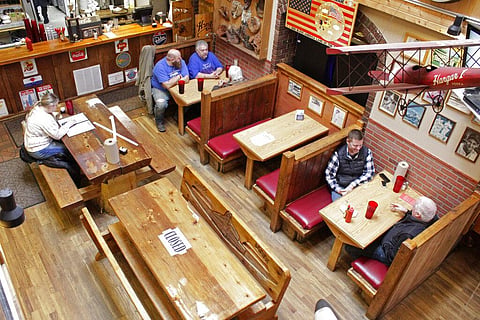Diners sit at the Carver Hangar, a restaurant in Boring, Ore., on Jan. 6, 2021. (Photo | AP)