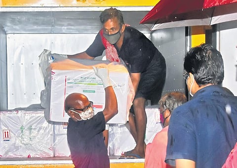 Workers unloading the first consignment of Pune-based Serum Institute’s Covishield vaccine at the regional vaccine store in Thiruvananthapuram on Wednesday | B P Deepu 
