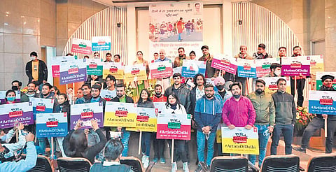 Deputy Chief Minister Manish Sisodia with the artists at the launch of AAP government’s flagship scheme. (Photo | Twitter)