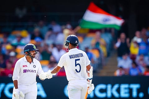 India's Washington Sundar (R) is congratulated by Shardul Thakur (L) after reaching his half century. (Photo | AFP)