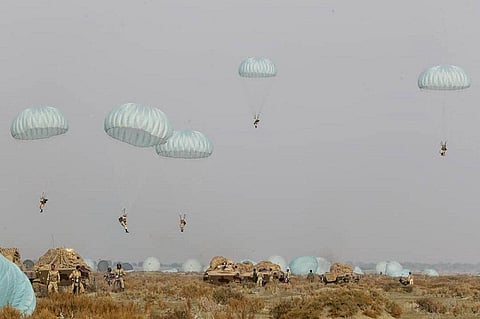 In this photo released on Tuesday, Jan. 19, 2021, by the Iranian Army, shows paratroopers parachuting during a military drill. (Photo | AP)ira