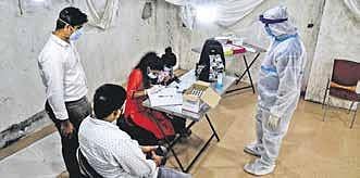 File photo of health workers writing details of people who were tested at a camp set up for free Rapid Antigen and RTPCR tests in Bengaluru | Shriram BN