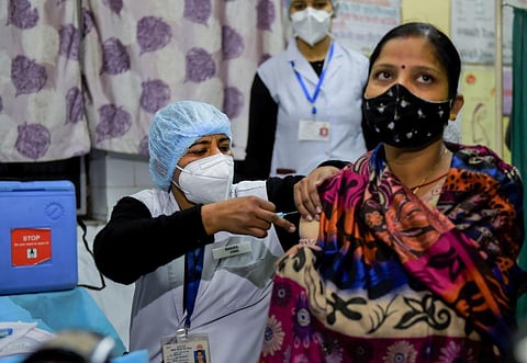 A health worker prepares for the dry run for the COVID-19 vaccine at a healthcare center. (Photo | PTI)