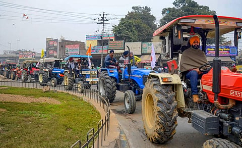 Farmers take out a tractor march as part of the preparations for their planned tractor parade in the national capital on Republic day during a protest against the new farm laws. (Photo | PTI)