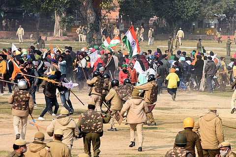 Police chase away protesters and farmers who had reached the Red Fort after the Republic Day parade in Delhi on Tuesday. (Photo | Parveen Negi, EPS)
