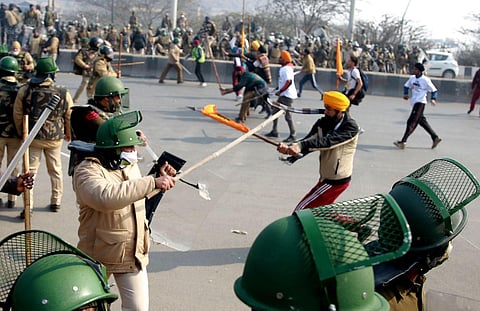 Farmers and their supporters clash with police near Mukarba Chowk in New Delhi on Tuesday. (Photo | Shekhar Yadav, EPS)