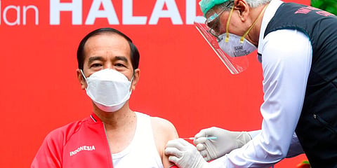 Joko Widodo receives a shot of COVID-19 vaccine at Merdeka Palace in Jakarta, Indonesia. (Photo | AP)