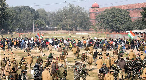Police chase away protesters and farmers who had reached the Red Fort after the Republic Day parade in Delhi. (Photo | Parveen Negi, EPS)