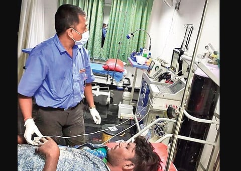 A paramedic checks a patient’s vitals at a trauma care centre along the ORR. (Photo | Express)