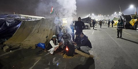 Farmers during their ongoing agitation over Centre's farm reform laws at Ghazipur border in New Delhi. (Photo | PTI)