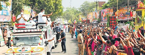 CM Edappadi K Palaniswami, Deputy CM O Panneerselvam waving to supporters at Thirumangalam in Madurai on Sunday