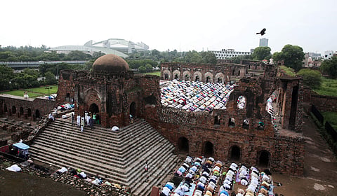 File | Devotees offer Eid al-Adha prayers at Feroz Shah Kotla mosque in New Delhi. 
