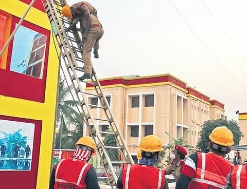 Fire fighters conduct a mock safety drill during the inauguration of Fire Park in Bhubaneswar on Tuesday. (Photo | EPS/Irfana)