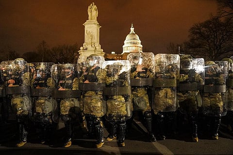 District of Columbia National Guard stand outside the Capitol, Wednesday night, Jan. 6, 2021, after a day of rioting protesters. (Photo | AP)