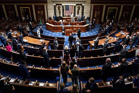 Electoral college votes are brought as Speaker of the House Nancy Pelosi, D-Calif., and Vice President Mike Pence officiate as a joint session of the House and Senate reconvenes. (Photo | AP)
