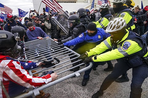 Trump supporters try to break through a police barrier, Wednesday, Jan. 6, 2021, at the Capitol in Washington. (Photo | AP)