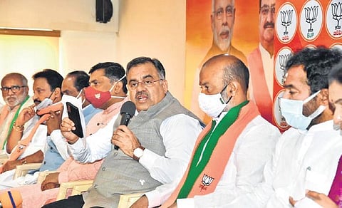 BJP Telangana in-charge Tarun Chugh addresses an MLC poll prep meet on Thursday. State chief Bandi Sanjay Kumar and MoS for Home Kishan Reddy are also seen