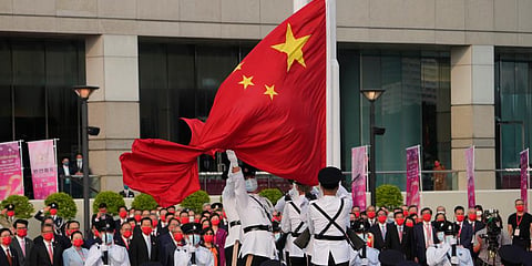 A flag raising ceremony for the celebration of China's National Day is held at the Golden Bauhinia Square, in Hong Kong. (Photo | AP)