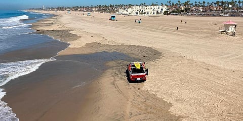 Few people visit the beach a week after the ocean was closed to surfing and swimming due to an offshore pipeline leak in Huntington Beach, California. (Photo | AP)