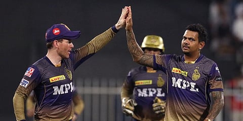 Sunil Narine of KKR celebrates the wicket of KS Bharat of RCB during the eliminator match of IPL 2021 at the Sharjah Cricket Stadium in Sharjah on Monday. (Photo | ANI)