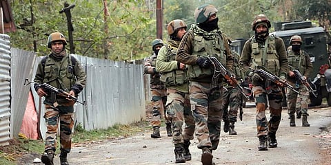 Security personnel inspect near an encounter site. (Photo | ANI)
