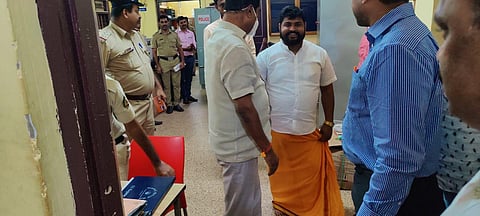 MLA Umanath Kotian with the two accused in the 'moral policing' incident in Moodbidri police station (Photo | Special arrangement)