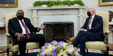 US President Joe Biden (R) listens as Kenyan President Uhuru Kenyatta (L) speaks during their meeting in the Oval Office of the White House in Washington. (Photo | AP)