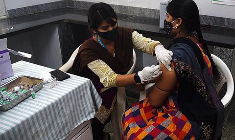 A health worker administers Covid vaccine to a woman. (File Photo | Express)