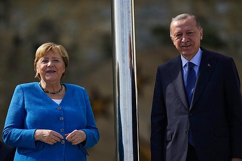German Chancellor Angela Merkel, left, is welcomed by Turkish President Recep Erdogan on occasion of their meeting at Huber Villa presidential palace, Istanbul, Turkey, Saturday. (Photo | AP)