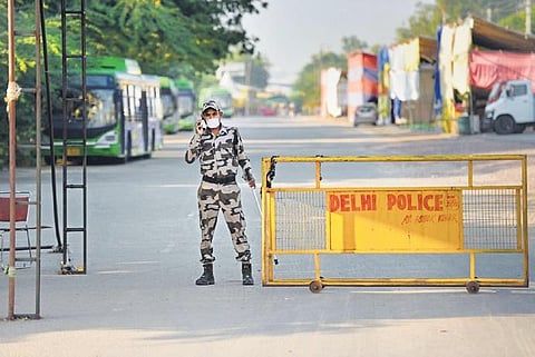 A security personnel keeps vigil at Singhu border near the site of the farmers’ protest, in Delhi. (File Photo | PTI)