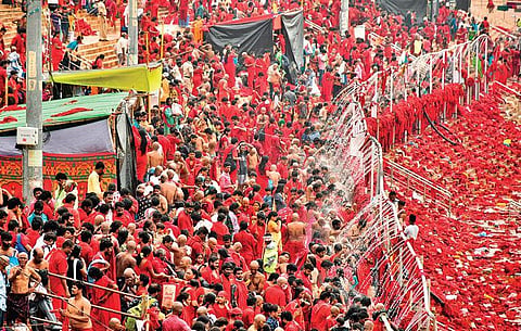 Bhavani Deeksha devotees at the ghat, where showers were arranged during Dasara  in Vijayawada. (Photo | Prasant Madugula, EPS)