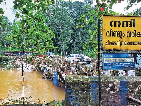 The plastic garbage from the Chittarpuzha river piled up on the Ponkunnam-Chirakkadavu bridge in Kottayam district post flood. (Photo | EPS)