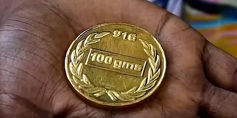 The sanitation worker returned the gold coin soon after finding it in the garbage.