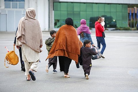 U.S.-affiliated Afghans arrive at the Pristina International Airport in Kosovo. (File Photo | AP)
