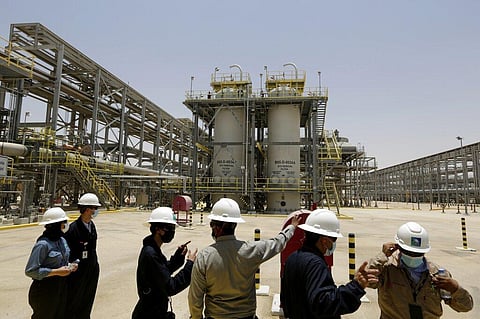 Saudi Aramco engineers and journalists look at the Hawiyah Natural Gas Liquids Recovery Plant in Hawiyah, in the Eastern Province of Saudi Arabia. (File Photo | AP)