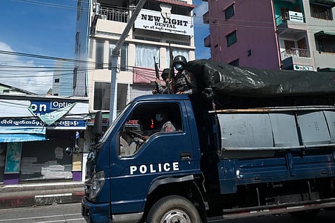 Police patrol in a truck in downtown Yangon, Myanmar, on October 22, 2021. (Photo | AFP)