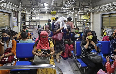 Representational Image | Women passengers travel on a local train in Mumbai (Photo | AP)
