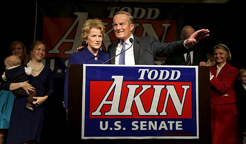 U.S. Senate candidate, Rep. Todd Akin, R-Mo., and his wife Lulli acknowledge supporters before Akin makes his concession speech. (File photo | AP)