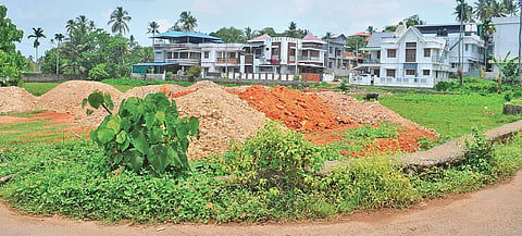 Soil dumped on the paddy field at Karippassery near HMT Junction in Kalamassery |  A Sanesh