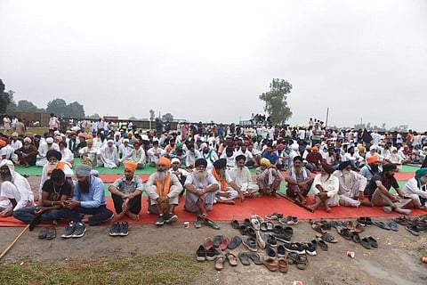 Farmers mourn the death of fellow farmers killed Sunday after being run over by a car owned by India's junior home minister at Tikonia village in Lakhimpur Kheri. (Photo | AP)