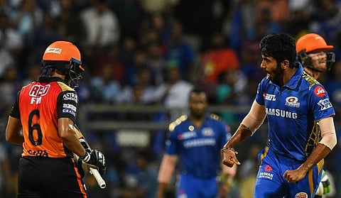 Mumbai Indians cricketer Jasprit Bumrah (R) celebrates after the dismissal of Sunrisers Hyderabad cricketer Wriddhiman Saha (File photo| AFP)