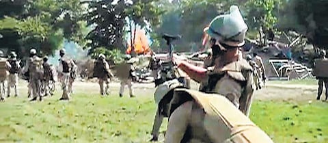 Police try to disperse people protesting against eviction drive in Darrang, Sept 23, 2021. (Photo | PTI)