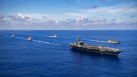 US naval ships conduct a passing honors ceremony in the Pacific Ocean. (Photo | AP)