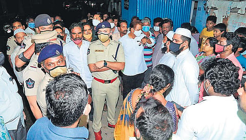 Guntur Urban SP Arif Hafeez interacting with people in Railpet under programme to adopt problematic areas in the city to make it crime-free I Express