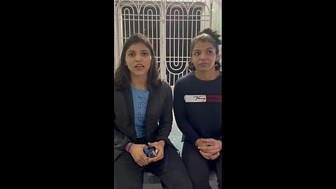 Wrestler Nisha Dahiya assures of her wellness along with Sakshi Malik in a video released by Wrestling Federation of India.  (Photo | Twitter, Wrestling TV Ind)