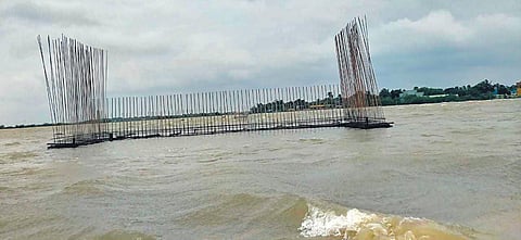Rains submerged the under-construction bridge near Pasiyavaram, leaving the islanders stranded for the past three days due to lack of connectivity | Express xpressxpress
