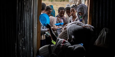 Tigrayans stand in line to receive food donated by local residents at a reception center for the internally displaced in Mekele, in the Tigray region of northern Ethiopia. (Photo  | AP)