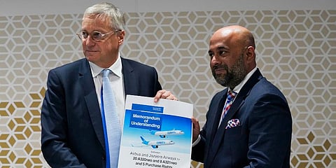 Airbus CCO Christian Scherer (L) and Jazeera Airways CEO Rohit Ramachandran show a commemorative memorandum of understanding for an aircraft sale at the Dubai Air Show. (Photo | AP)